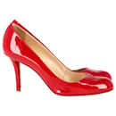 Sapatos Christian Louboutin de bico redondo em couro envernizado vermelho