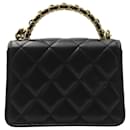 Chanel Mini Handle Clutch with Chain in Black Lambskin Leather
