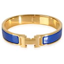 Pulsera Hermès Clic H en azul real bañada en oro