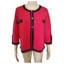 Chanel cashmere cardigan in red with navy blue trim.