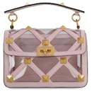 VALENTINO GARAVANI Roman Stud medium handbag in pastel pink polymeric material and leather. - Valentino Garavani