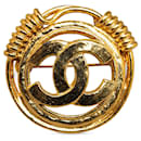 Broche Chanel CC dorée