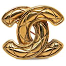 Broche matelassée Chanel CC dorée