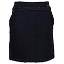 Mini-jupe à détail de chaîne Chanel en tweed noir