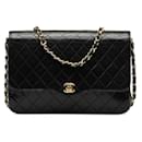 CC Quilted Leather Flap Bag - Chanel