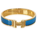 Pulseira Hermès Clic H azul banhada a ouro