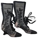 Naughtily-D wedge heel boot. Transparent mesh embroidered with a butterfly motif and black suede calf. - Dior