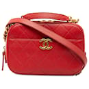 Petit sac photo matelassé rouge Chanel avec poignée supérieure en caviar