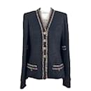 Jaqueta de tweed preto com botões CC raros e atemporais. - Chanel