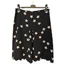 Shorts de seda com estampas icônicas de estrelas CC. - Chanel
