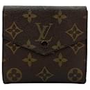Portefeuille vintage Louis Vuitton en mini porte-monnaie en toile Monogram.