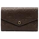 Louis Vuitton Portefeuille Curieuse Leather Long Wallet M60543 en bon état