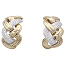 Repossi “Tresse” gold and diamond earrings.