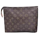 Louis Vuitton Pochette MM in Brown Coated Canvas