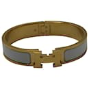 Hermès Enamel Clic Clac H Bracelet in Gold Metal