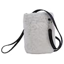 Jil Sander-Tasche aus weißem Lammfell mit Lederbesatz 