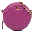 Chanel – Runde Clutch aus rosa Lammleder mit Perlen und Kette