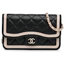 Chanel Soporte para teléfono con solapa 23B de piel de cordero bicolor negra