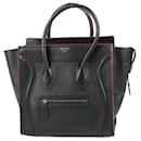 Celine – Micro-Gepäckhandtasche aus schwarzem Leder mit roter Glasur - Céline