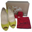 Christian Louboutin suede You You 85 Peep Toe pumps in Anis.
