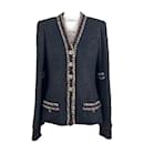 Jaqueta de tweed preta com botões CC raros e atemporais. - Chanel