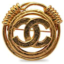 Broche vintage Chanel Coco Mark plaquée or en très bon état