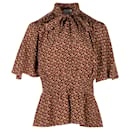 Blusa Burberry con estampado de monogramas en seda marrón