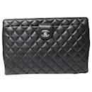 Chanel Quilted Lambskin Timeless Frame Clutch in Black Leather