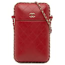 Bolso bandolera con soporte para teléfono y cadena acolchada de piel de cordero Chanel CC rojo