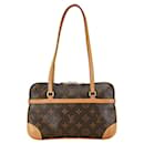 Sac à main Louis Vuitton Monogram Mini Coussin M51143 en cuir PVC marron en très bon état