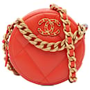 Clutch redondo Chanel de piel de cordero naranja 19 con cadena