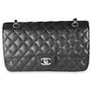 Bolso de doble solapa clásico mediano en caviar negro acolchado Chanel