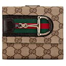 Piccola wallet Hasler in tela GG marrone di Gucci
