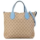 Bolsa tote reversível em canvas GG bege da Gucci Medium