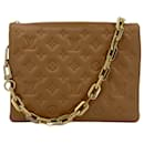 Coussin PM Empreinte Cuero Bolsa Mensajera 3 Vías Camel - Louis Vuitton