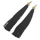 SAINT LAURENT PARIS Boucles d'oreilles longues à pompons pour femme en or et noir en excellent état - & Other Stories