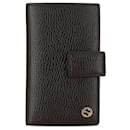 Portefeuille long en cuir marron Gucci avec G entrelacé