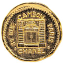 Broche en or plaqué Chanel 31 Rue Cambon