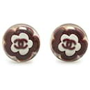 Boucles d'oreilles clip-on en résine rouge Chanel avec fleur CC