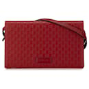 Bolso cruzado rojo Gucci Microguccissima con billetera en la correa