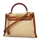 Sac à main Hermes Kelly 32 en or - Luxe d'occasion - Hermès