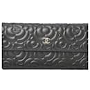 Porte-monnaie en agneau noir Chanel