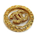 Broche circular em ouro CC da Chanel