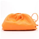 Bottega Veneta Mini The Pouch Leather Shoulder bag in Orange