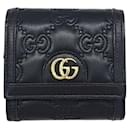 Billetera bi-fold Gucci en cuero negro