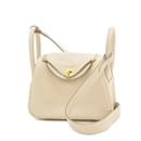 Hermes Lindy Handbag in Ivory Taurillon Clemence Leather - Hermès