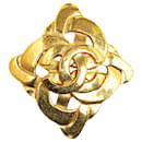 Broche chapado en oro Chanel Coco Mark