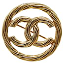 Broche chapado en oro Chanel Coco Mark