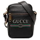 Cruzada negra con logo de Gucci