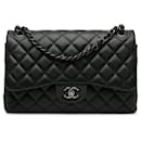 Schultertasche Chanel Jumbo Classic Caviar Double Flap Schwarz